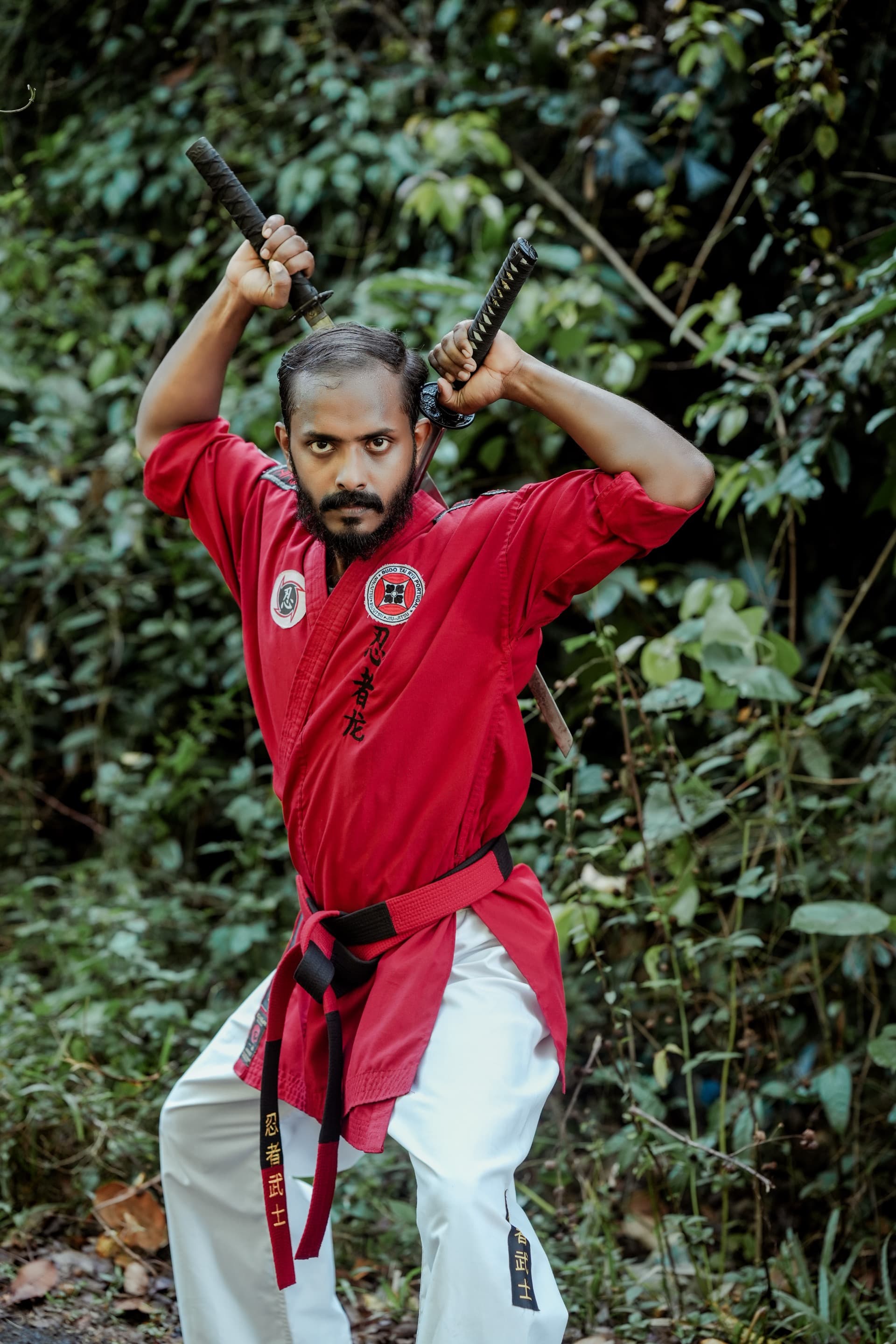 Master Divo Das with dual swords overhead