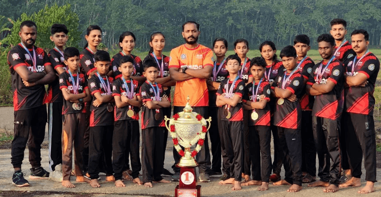 Ninja MMAFA team with championship trophies